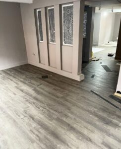 The flooring is going down and looks pretty gorgeous.